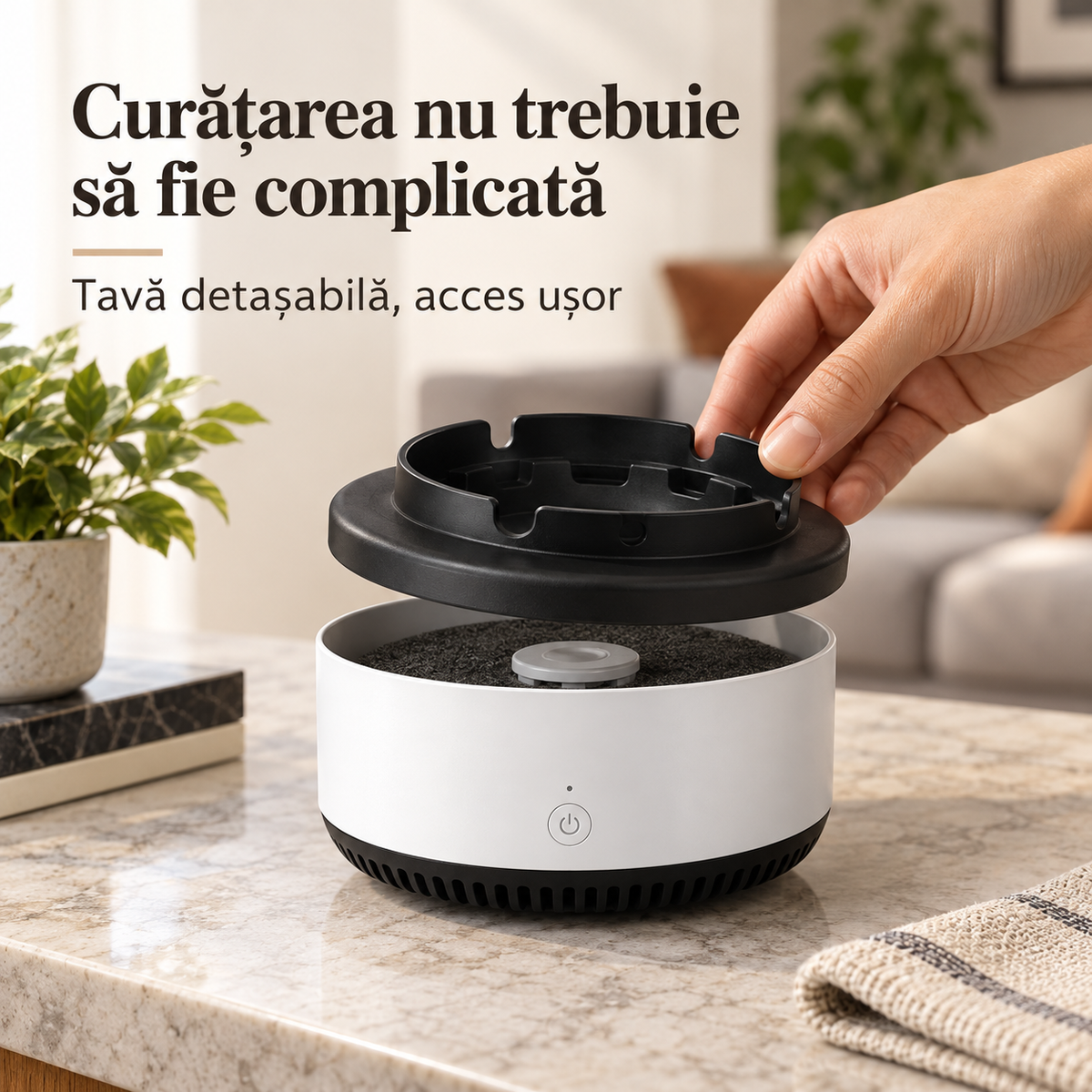 Tava detașabilă a scrumierei electrice, ridicată pentru curățare.